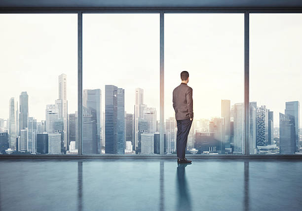istock Man in suit looking at sunrise. 3d render 473698650