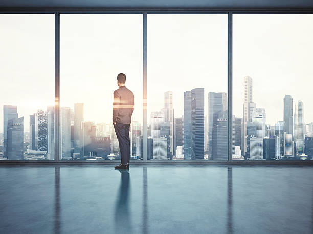 istock Businessman looking at city. 3d render 473698654
