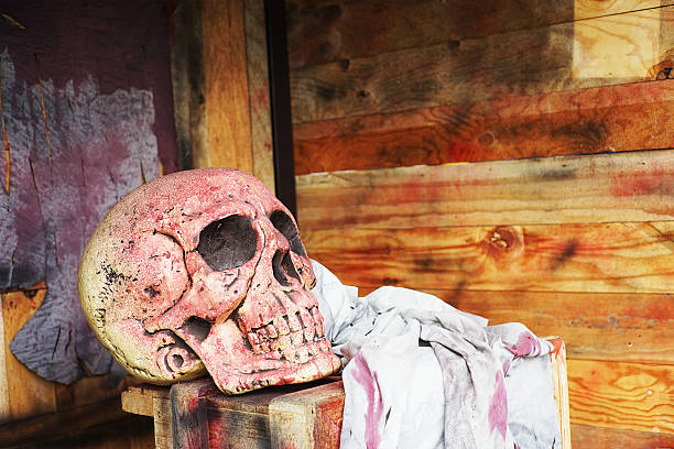 istock skull and dirty cloth  on wooden box 473699022