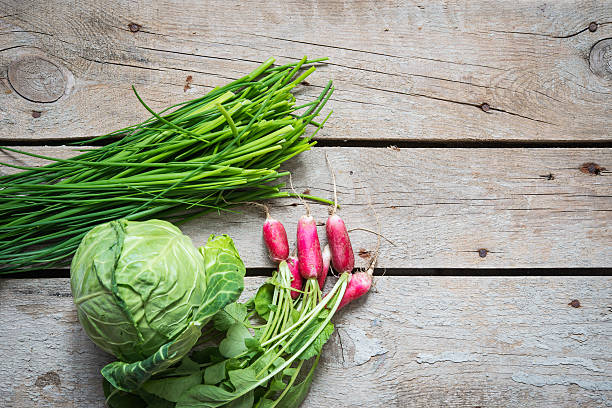 istock Fresh vegetables on a wooden background 473702460