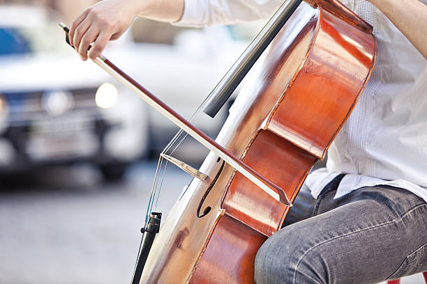 istock guy who plays the cello at  street in summer 473703314