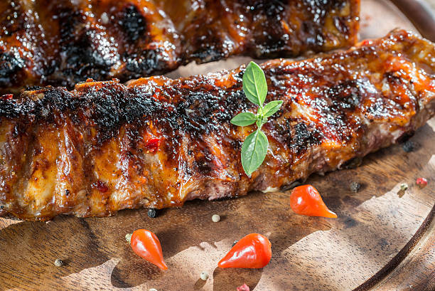 istock Grilled pork ribs on the wooden board 473709826