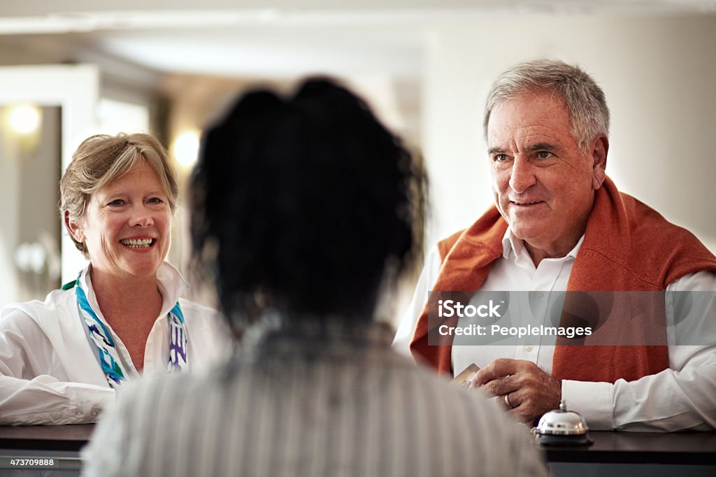 Welcome. We hope you enjoy your stay Cropped shot of a senior couple checking in at the hotelhttp://195.154.178.81/DATA/i_collage/pi/shoots/781118.jpg Hotel Reception Stock Photo