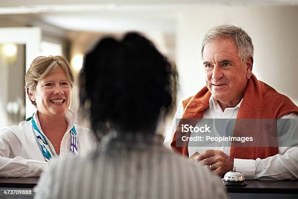 Welcome We Hope You Enjoy Your Stay Stock Photo - Download Image Now - Hotel Reception, Senior Adult, Hotel