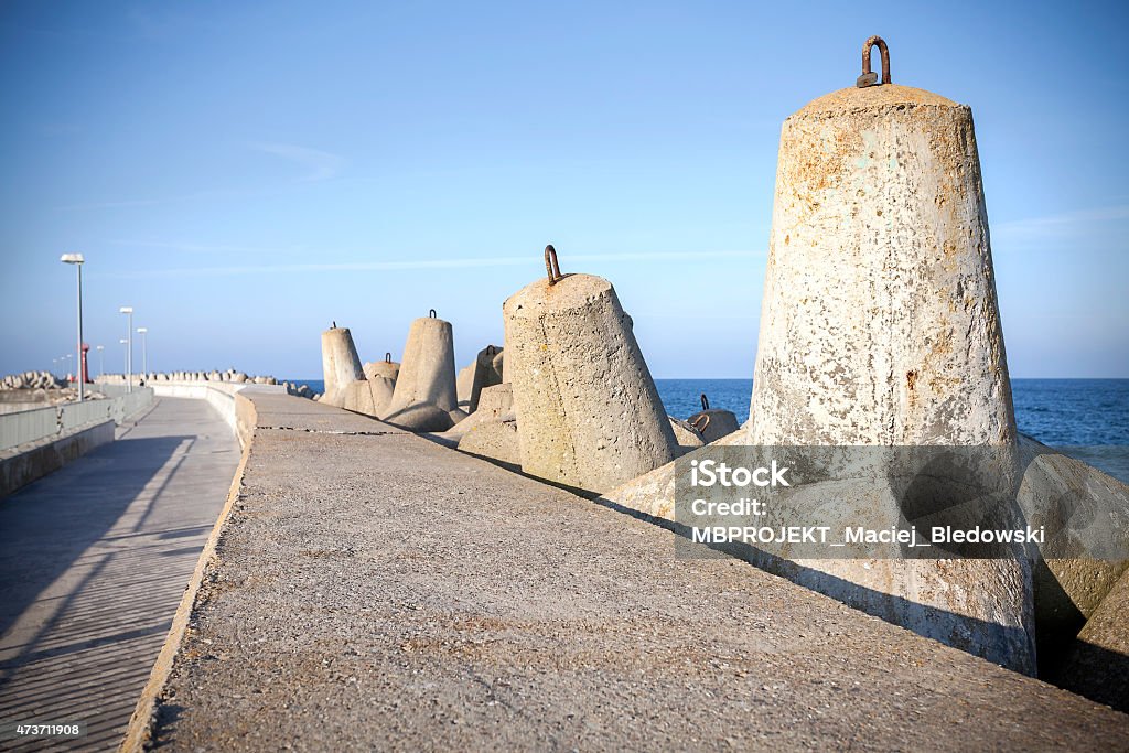 Sea pier and concrete block breakwaters. Sea pier and concrete block breakwaters in Kolobrzeg, Poland. 2015 Stock Photo