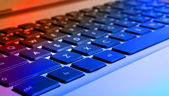 Closeup view of computer (notebook) keyboard, colorized