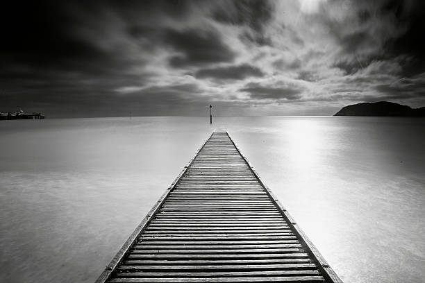 istock lonely jetty by the sea 473715210