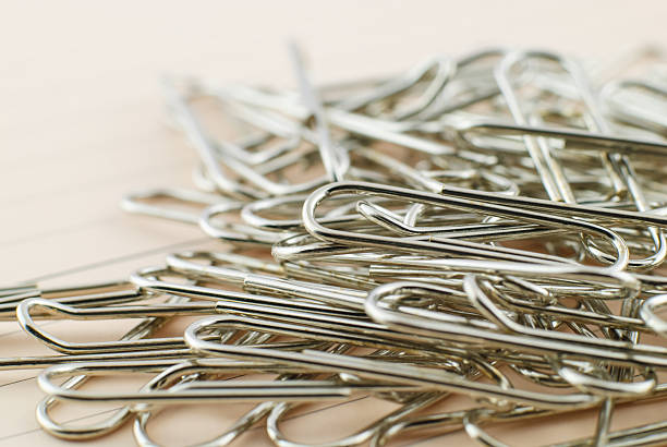 istock Paper clip and pink paper 473716258