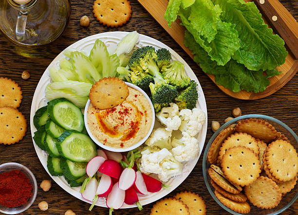 istock homemade hummus with raw vegetables. 473719202