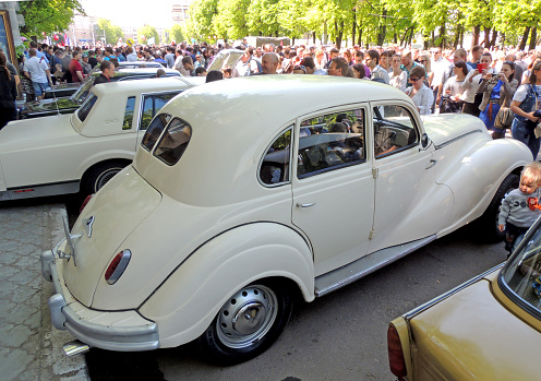 Voronezh, Russia - May 9, 2015: city dwellers look round retro car BMW 340 (EMW 340) on the street near city central square during the celebration of the Victory V-E Day