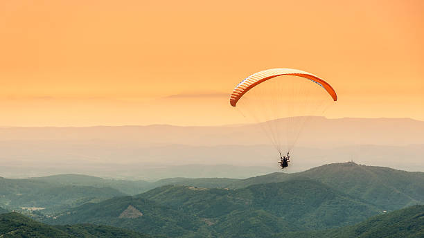 Paragliding flight stock photo