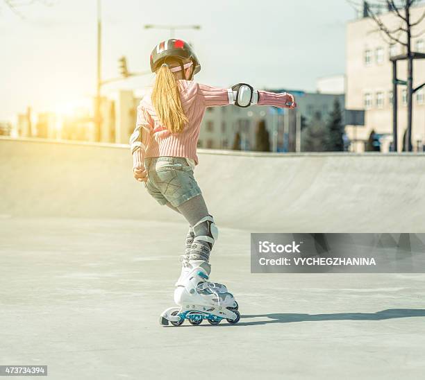Little Pretty Girl On Roller Skates Stock Photo - Download Image Now - 2015, Activity, Adult