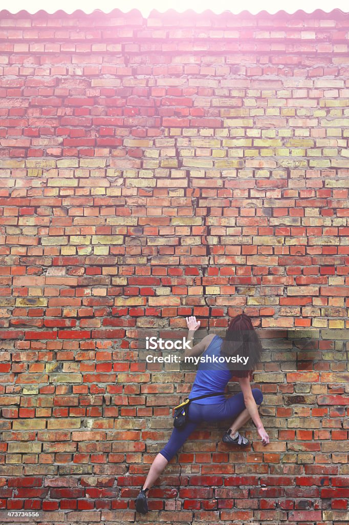 Free climbing on a brick wall Free climbing on a brick wall. Brick Wall Stock Photo