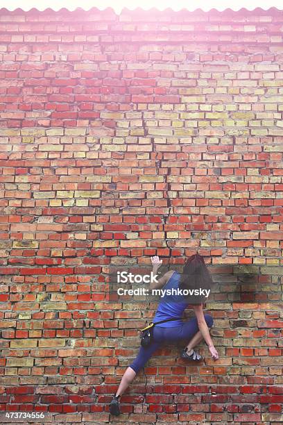 Free Climbing On A Brick Wall Stock Photo - Download Image Now - Brick Wall, People, Bouldering