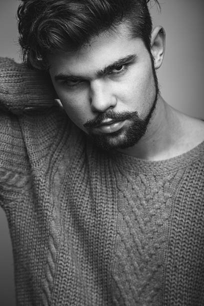 istock Black and white portrait of young man 473737312