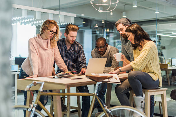 istock Group of creative people working on computer in the office. 473738294