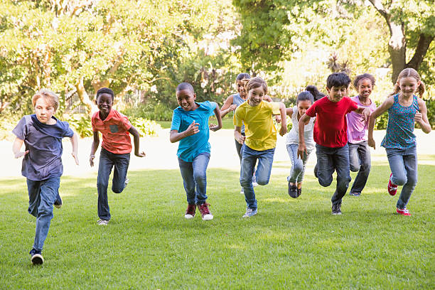 istock Happy friends running in the park 473742442