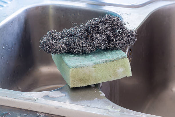 istock Used dishwashing sponge and metal dish scrubber 473742596