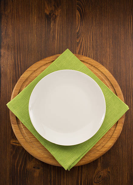 istock plate, knife and fork  on wood 473742618
