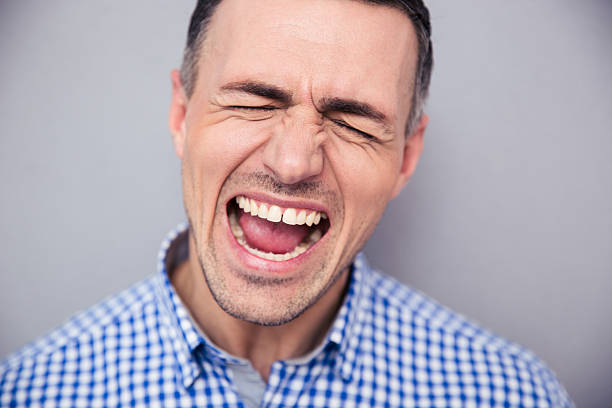 istock Portrait of a man screaming 473745398