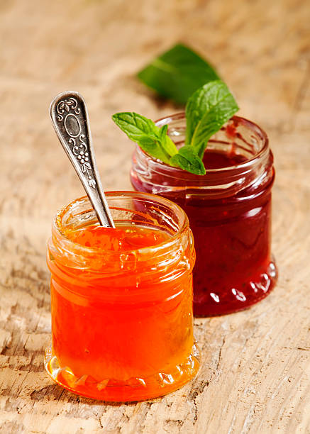 istock Two kinds of home-made jam from strawberry and apricot, selectiv 473745406