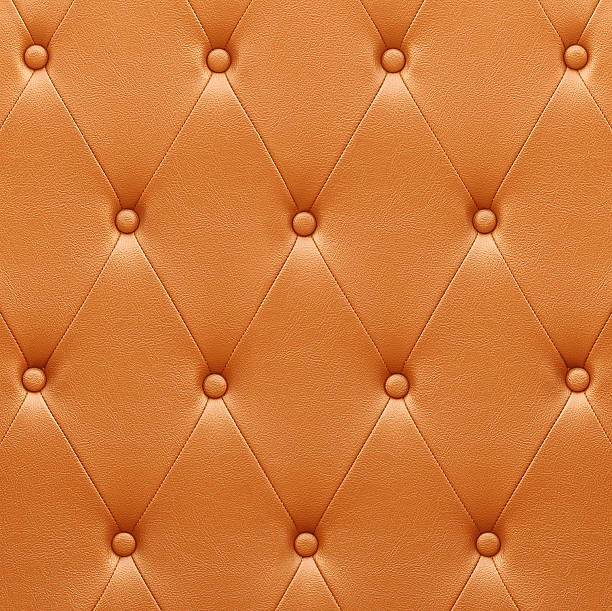 istock Pattern of orange leather seat upholstery 473746490