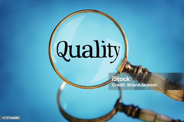 Magnifying Glass Focus On Word Quality Stock Photo - Download Image Now - Focus - Concept, Quality Control, Magnifying Glass