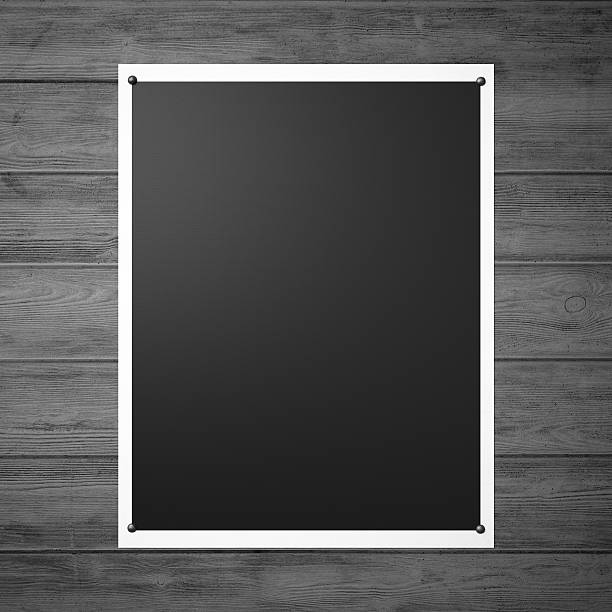 istock Black pinned poster on the vintage wooden wall. 3d render 473753700