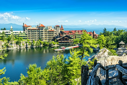 New Paltz, NY, USA - June 22, 2014:  The Mohonk Mountain House is a historic American resort hotel located on the Shawangunk Ridge Mountains in New Paltz, New York, USA. This main porch structure, which was designated a National Historic Landmark in 1986, was built by Quaker twin brothers Albert and Alfred Smiley between 1879 and 1910.