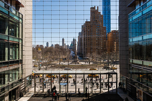 TIme Warner Center Mall New York, USA - March 22, 2015: A view from the second floor of the Time Warner Center mall late in the day as people enter and exit the mall. time warner center columbus circle pictures stock pictures, royalty-free photos & images
