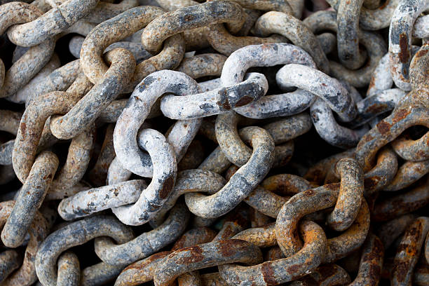 istock Chain with big shackles in a port 473761770