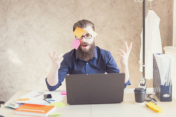 istock Crazy hipster having fun in office with paper stickers 473762392