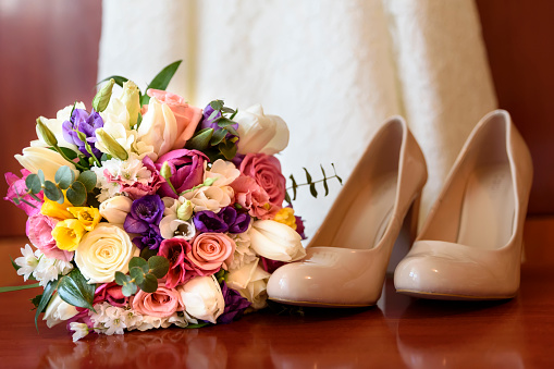 Shoes and bouquet - the bride's accesories 