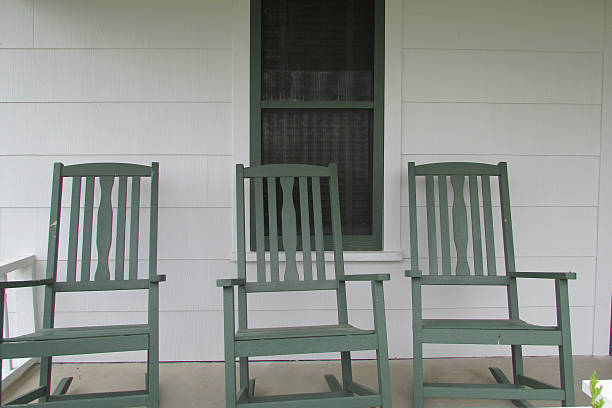 istock Green Rocking Chairs On Front Porch 473762900