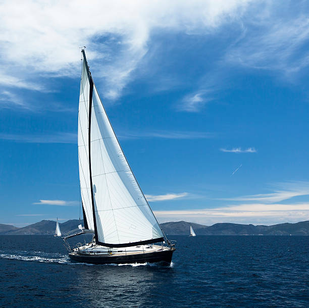 istock Sailing. Yacht sails with beautiful cloudless sky. 473765534