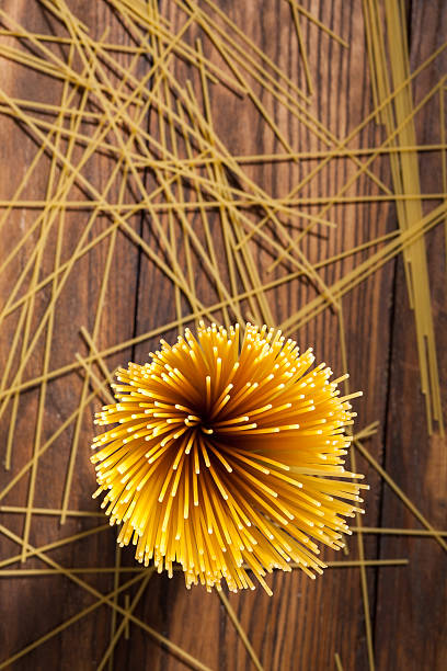 istock italian spaghetti on wooden background 473768344