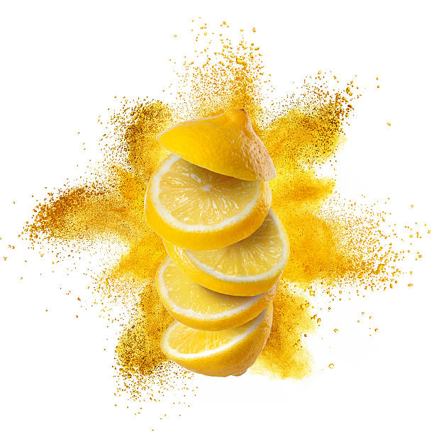 Slices of lemon with yellow powder explosion isolated