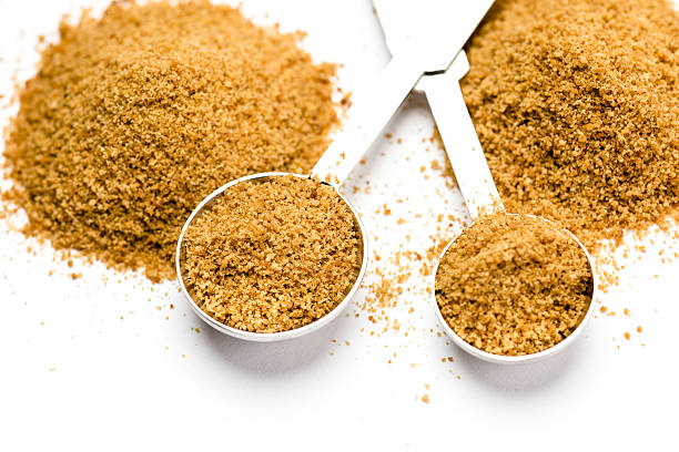 istock Coconut palm sugar in measuring spoons 473769974
