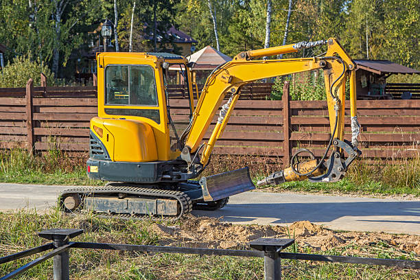 istock small yellow crawler excavator for screwing piles 473781776