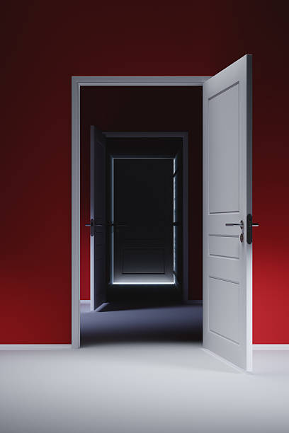 istock Closed door in the hallway with red walls 473785300