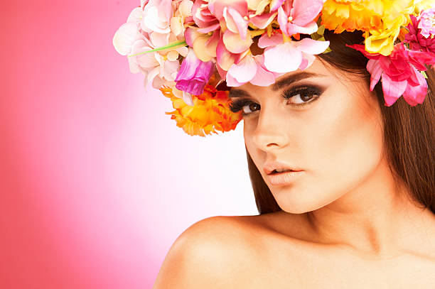 istock Beautiful woman with flower wreath 473785356