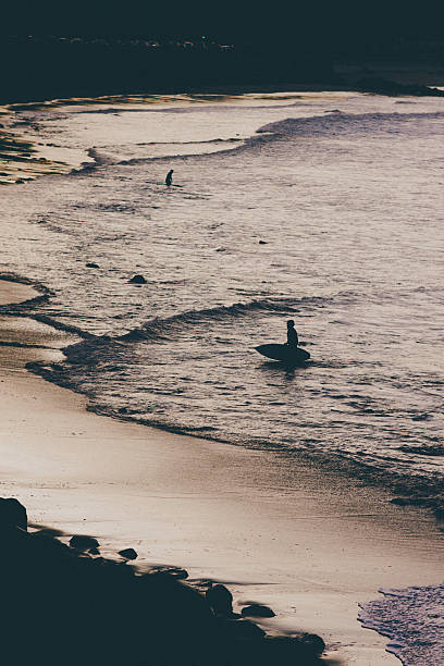 istock Surfer Leaving the Pacific Ocean 473785660