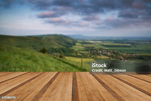 Vibrant Sunrise Over Countryside Landscape With Wooden Planks Fl Stock Photo - Download Image Now