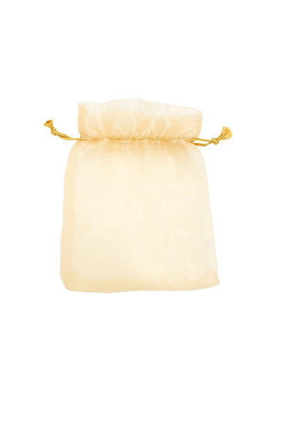istock gold bag isolated on white background 473789346