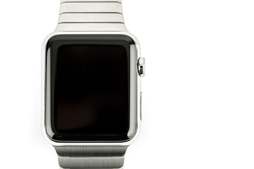 Montreal, Сanada - May 15, 2015: 42mm 316L Stainless Steel Apple Watch with Link Bracelet isolated on white background. The Apple Watch became available April 24, 2015 and is the latest device produced by Apple.