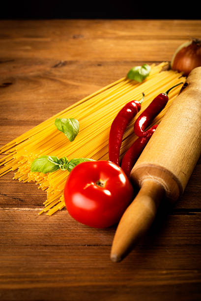 ingredients for spaghetti on a wooden table stock photo