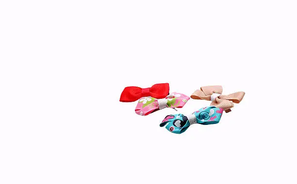 Bunch of coloured hairclips isolated on white