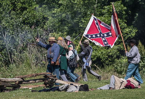 Red Bluff, California, United States-April 25, 2015: Confederate soldiers launch a counterattack toward Union positions during a Civil War reenactment.