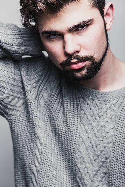 istock Portrait of a young man in gray pullover 473794282