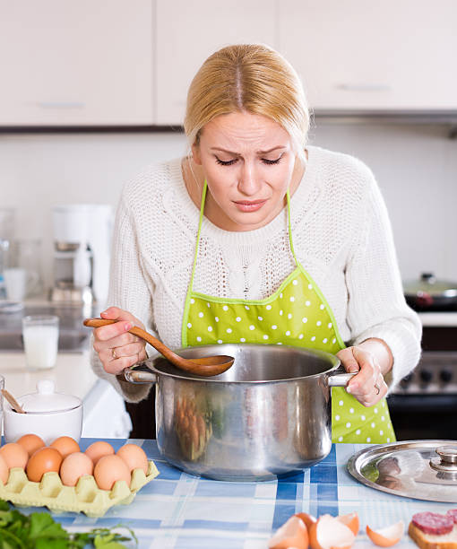istock Woman feeling bad smell from pan 473795096